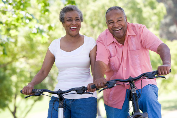 active seniors riding bikes - Senior Living Choices at Juniper Communities -
