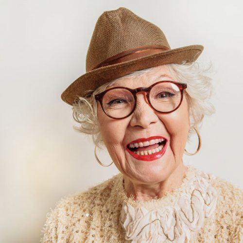 Resident with hat and glasses at Chatham Assisted Living