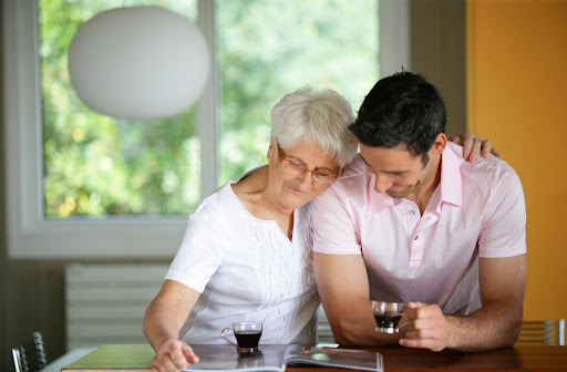 An older adult couple enjoying the pool of a personal care home.