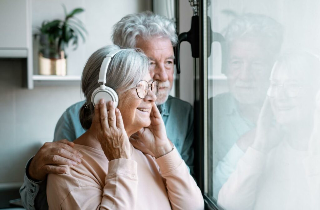 An older adult couple enjoying music therapy, promoting relaxation and emotional wellness.