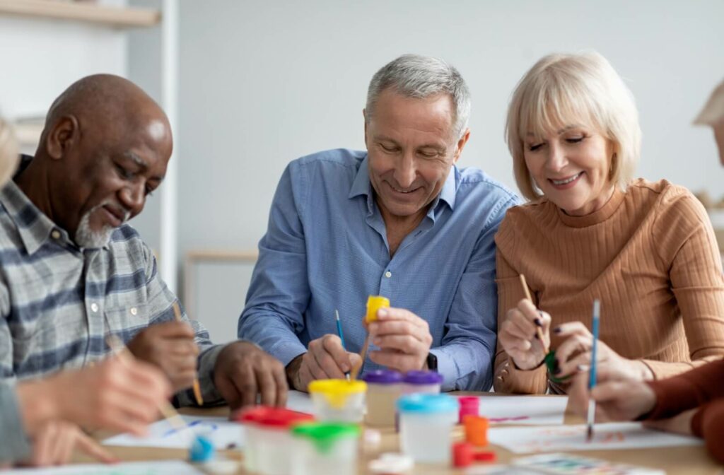 A group of older adults paticipating in painting activity