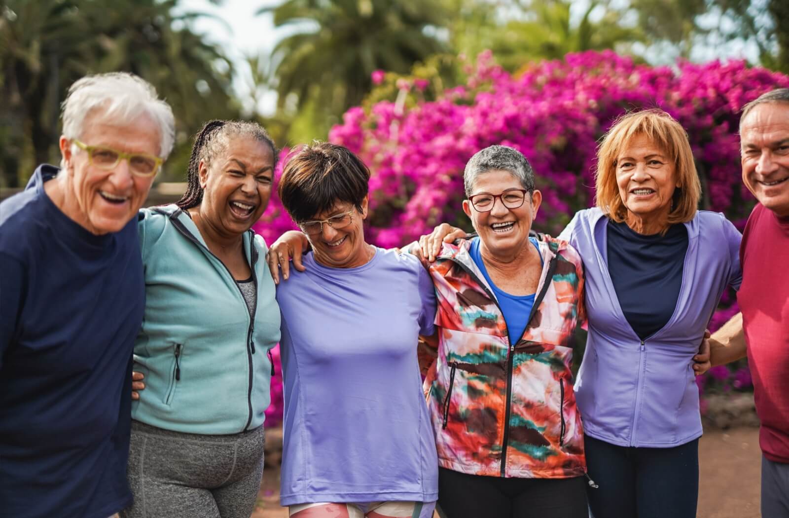 Group of older adults enjoying time outdoors together, staying active and social.