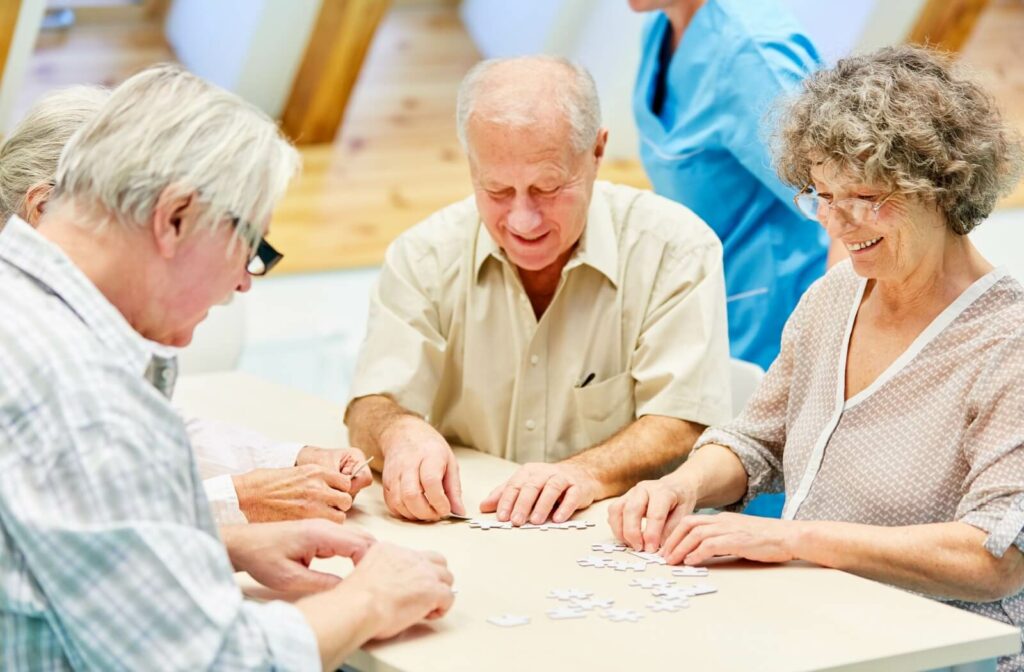 Older adults working together on a puzzle as part of an engaging group activity in assisted living.