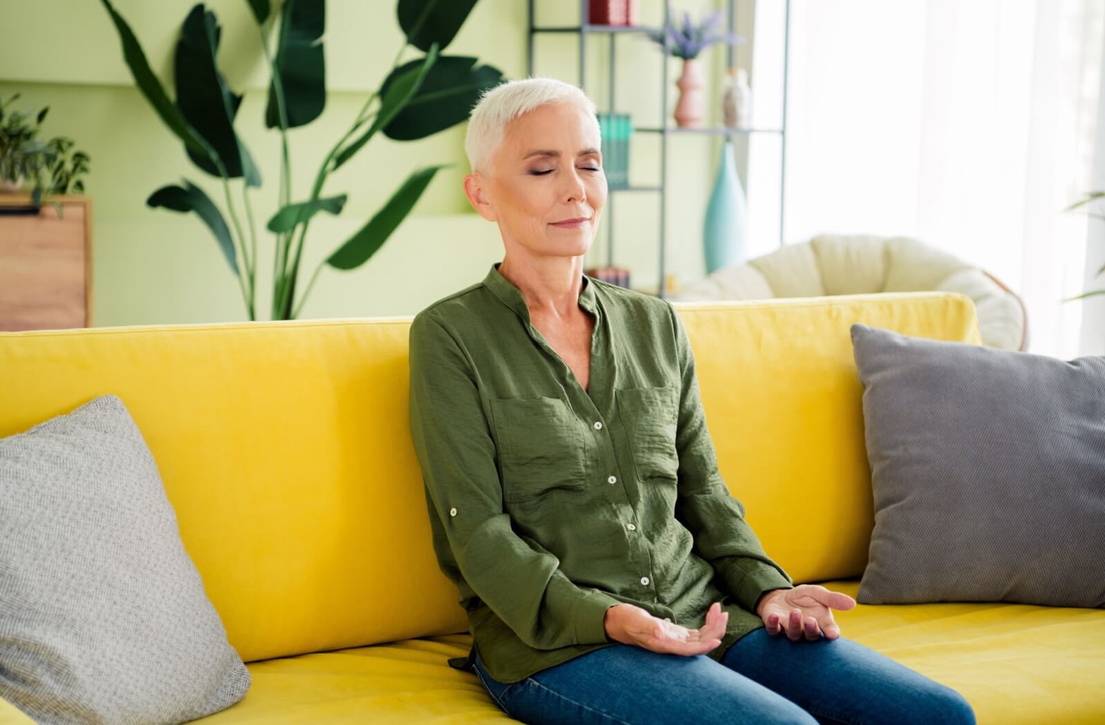 A calm older adult relaxes in a sensory-friendly room.