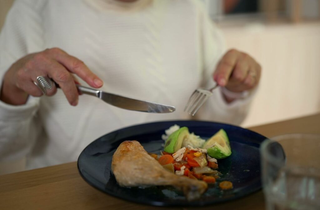A close up of an older adult's plate of nutrient-rich foods.