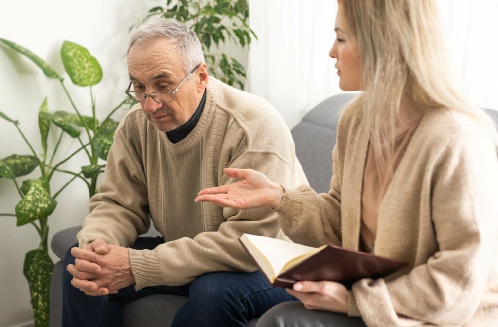 Older adult having a discussion with a caregiver about anxiety treatment.