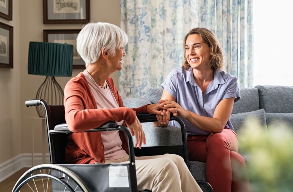 A family member offers gentle reassurance to their loved one, their hands warmly clasped together.