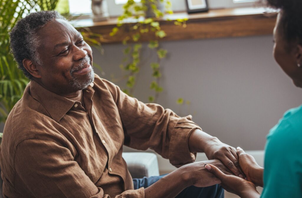 A caregiver supports an older adult with dementia.