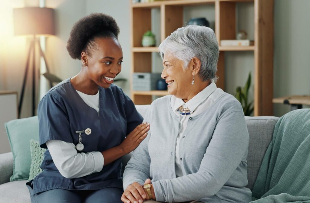A compassionate caregiver comforts a resident.