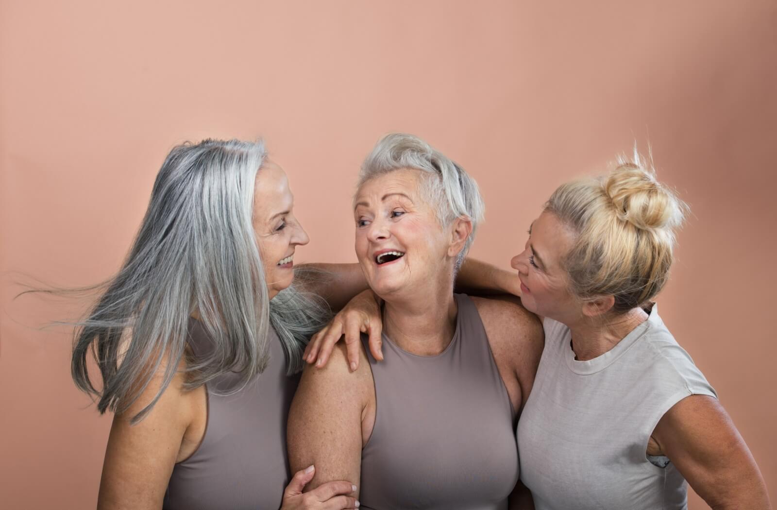 seniors smiling to each other and posing