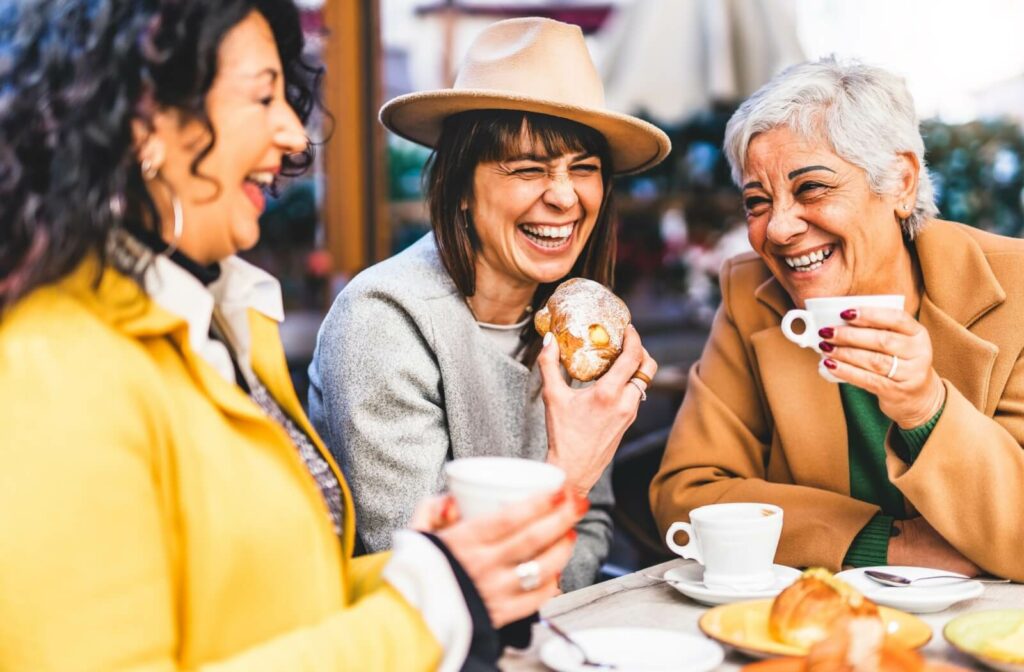 seniors sitting in a cafe enjoying coffee