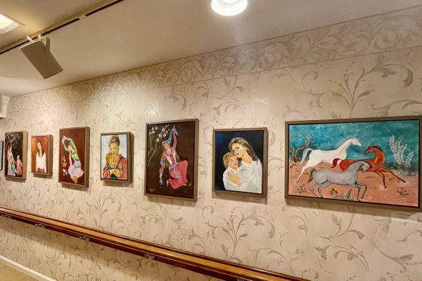 Local Artist Makes Rich Cultural Experience Possible for Juniper Residents at Brookline (hallway with artwork)
